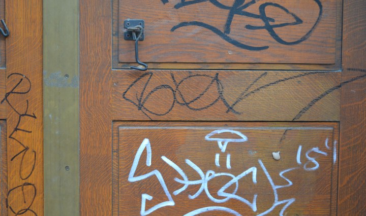Graffiti on Camden Town Hall door, Euston Road