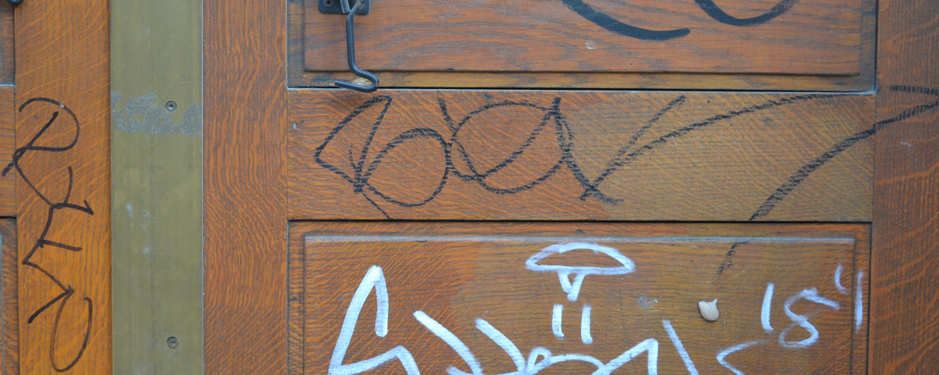 Graffiti on Camden Town Hall door, Euston Road