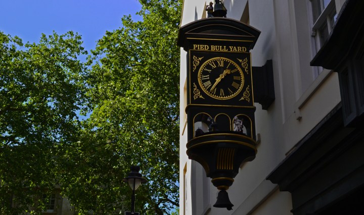 A beautiful wall clock outside Pied Bull Yard, Bloomsbury